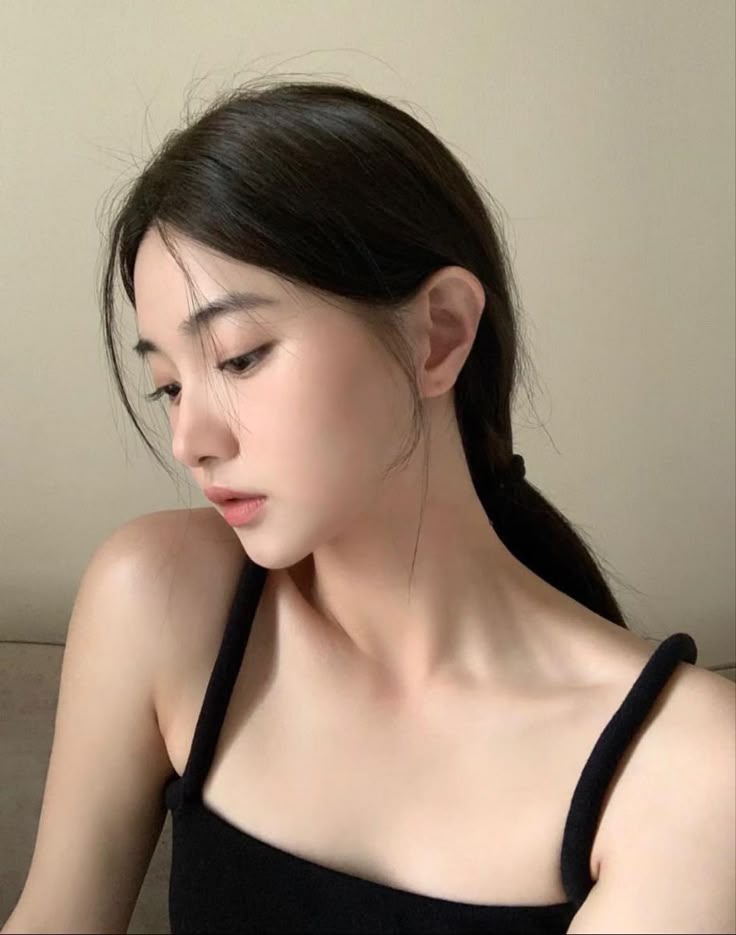 Neat low ponytail hairstyle with soft side hair