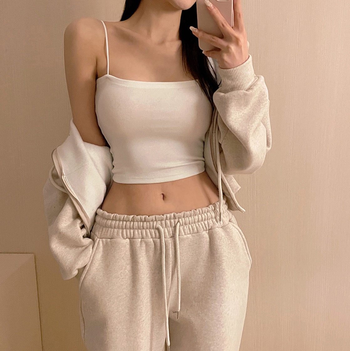 Woman wearing ivory crop top and jogger pants setup